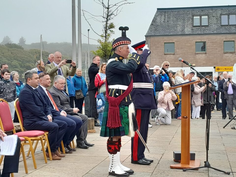 The Lord-Lieutenant and a senior Army officer salute.