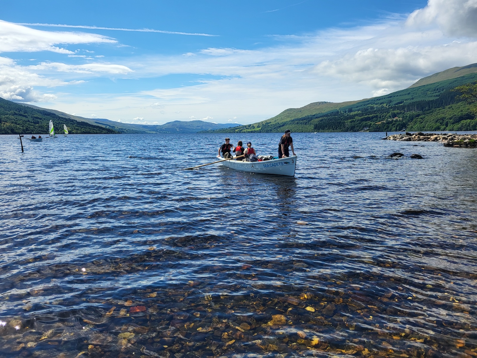 One of the rowing boats coming to shore at Loch Tay.