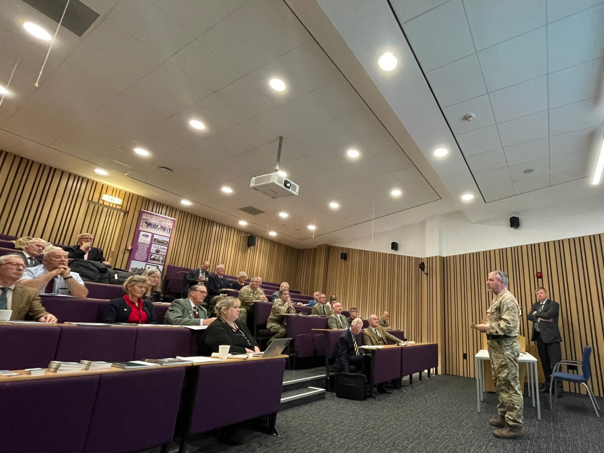 A unit representative speaking to the audience.