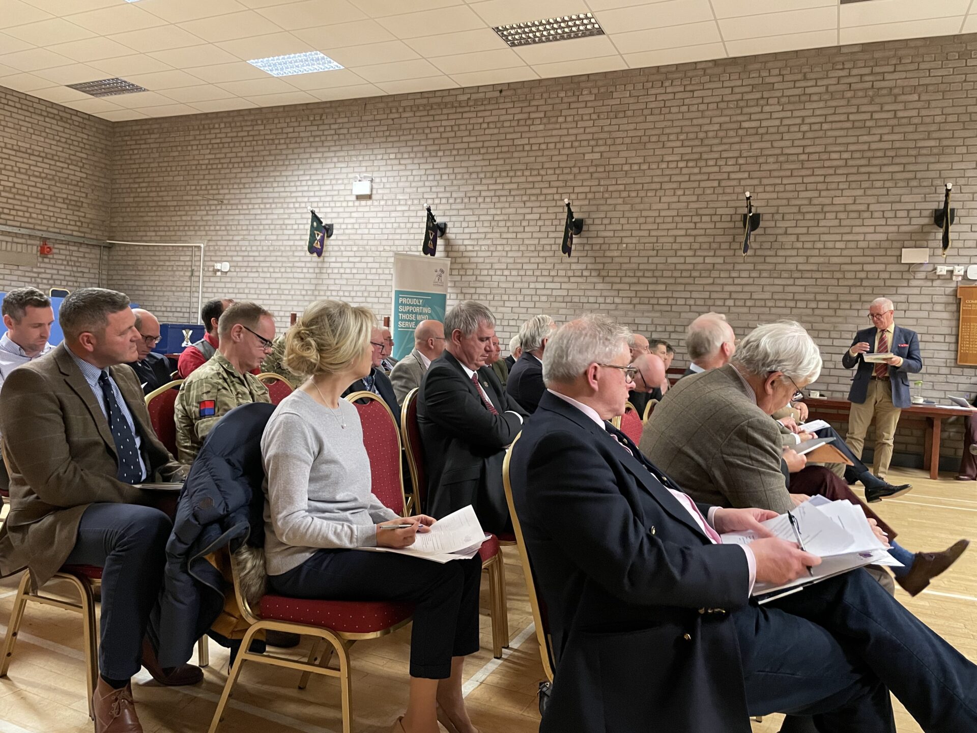 Unit representative speaking in front of the members.