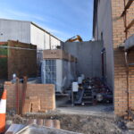 Air source heat pumps have been installed at the side of the building.