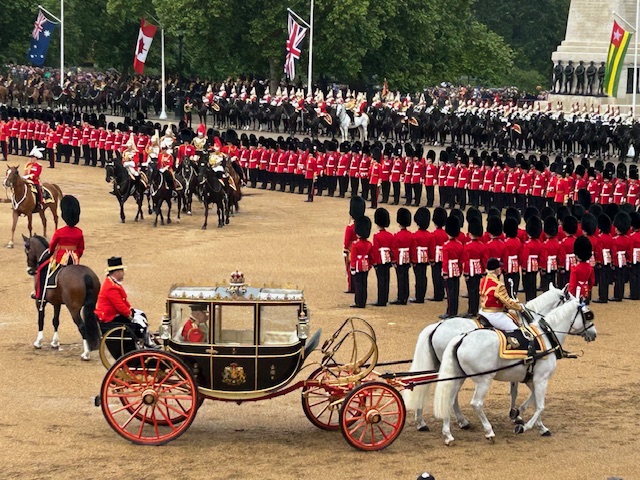 The King's carriage passes by during Trooping the Colour at Horse Guards Parade, London.