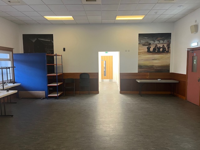 A view from the existing block towards a doorway into the new extension.