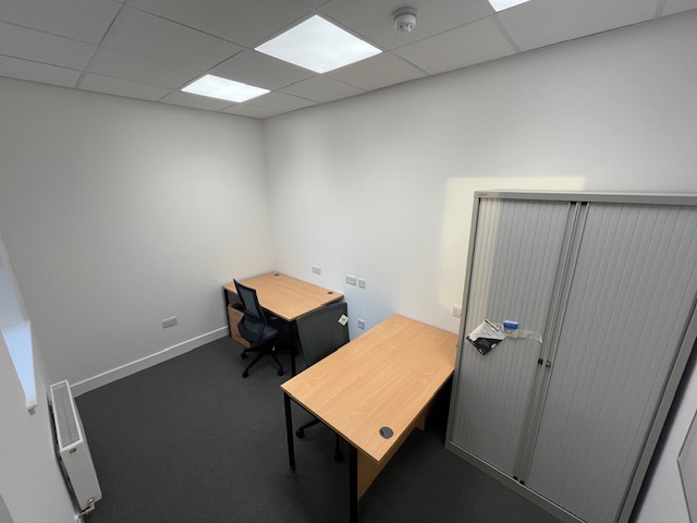 Tables and storage in an office space.