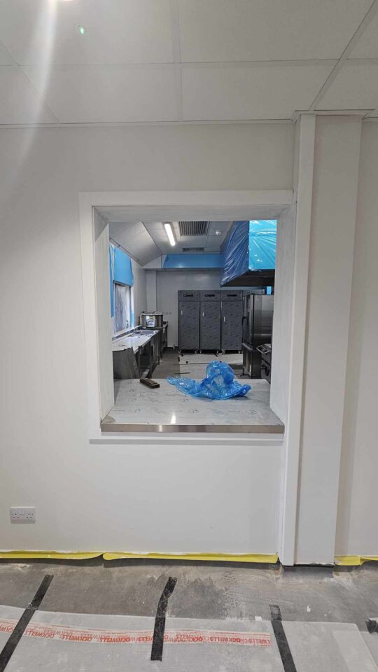 Looking through one of the new kitchen's serving hatches.