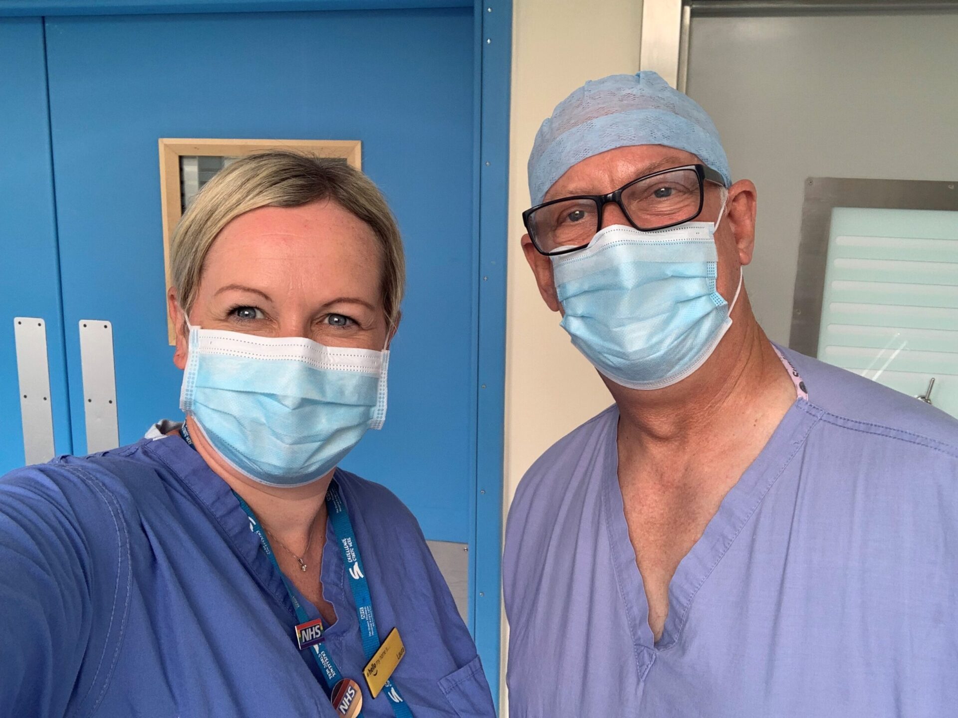 NHS Orkney Chief Executive and a Consultant Surgeon wearing face masks.