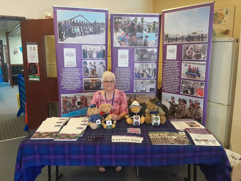 Head of Engagement Michelle McKearnon on the Highland RFCA stand at Boddam Cadet Training Centre along with five bear mascots.