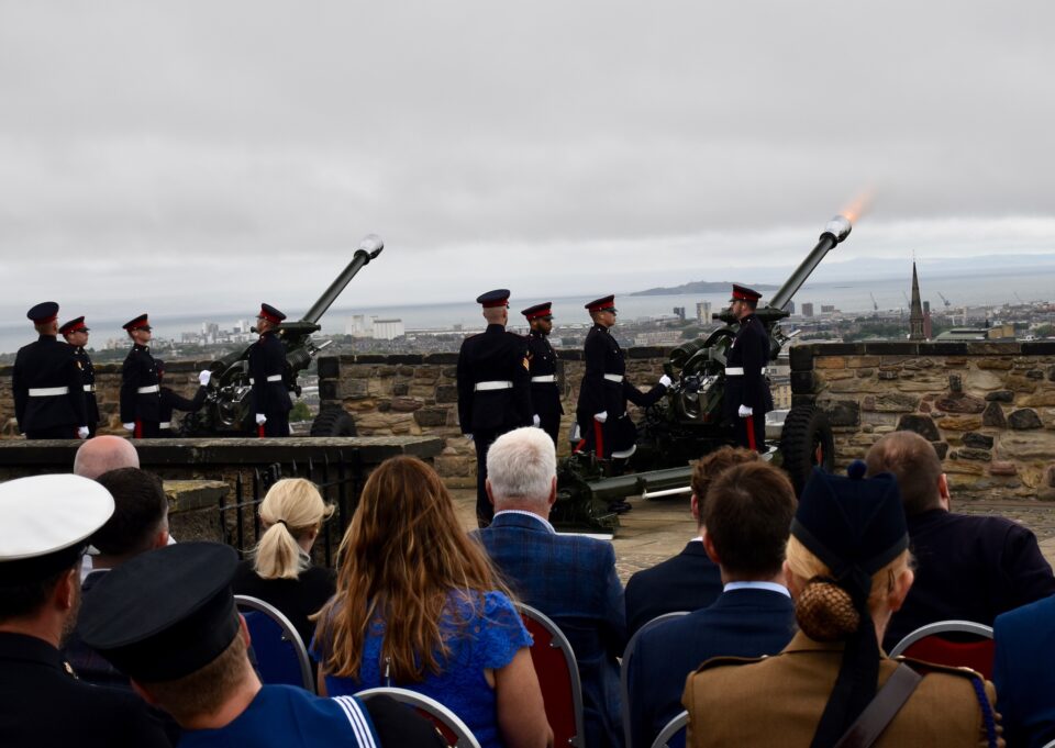 The 21-Gun Salute is fired as guests looks on at Edinburgh Castle.