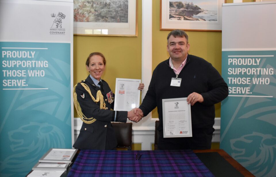Air Commodore Sonia Phythian presents the Armed Forces Covenant and ERS Bronze Award certificates to Peter Carmichael of Carmichael and Baxter Industrial Services at Edinburgh Castle.