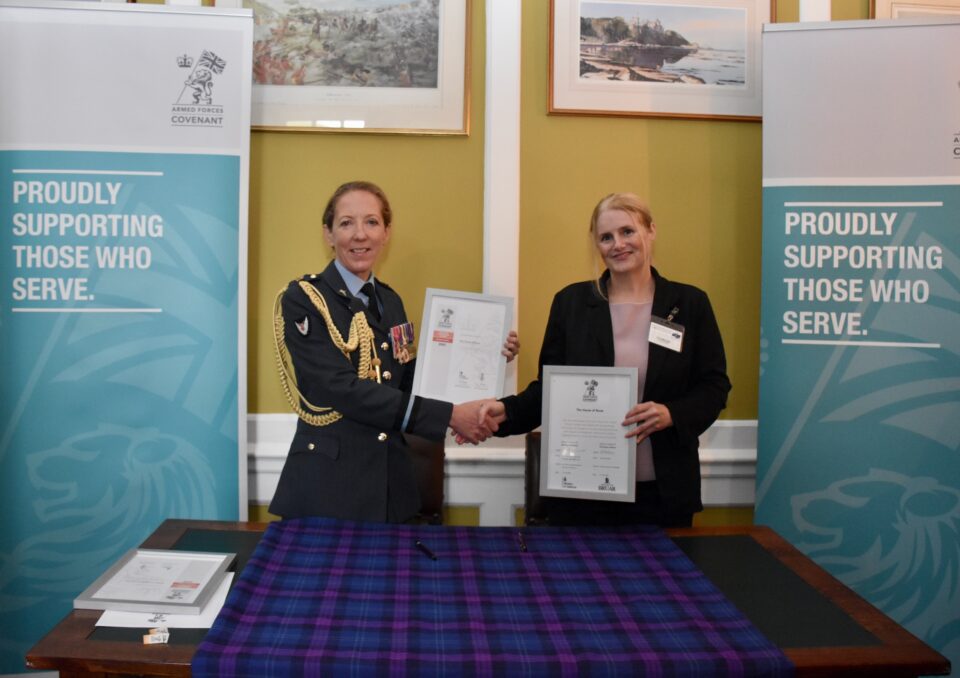 Air Commodore Sonia Phythian presents the Armed Forces Covenant and ERS Bronze Award certificates to Fiona McLellan of House of Bruar at Edinburgh Castle.