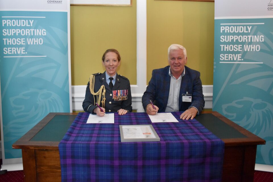 Air Commodore Sonia Phythian and George Burns of GBSS Civil Engineering Limited signing the Armed Forces Covenant at Edinburgh Castle.