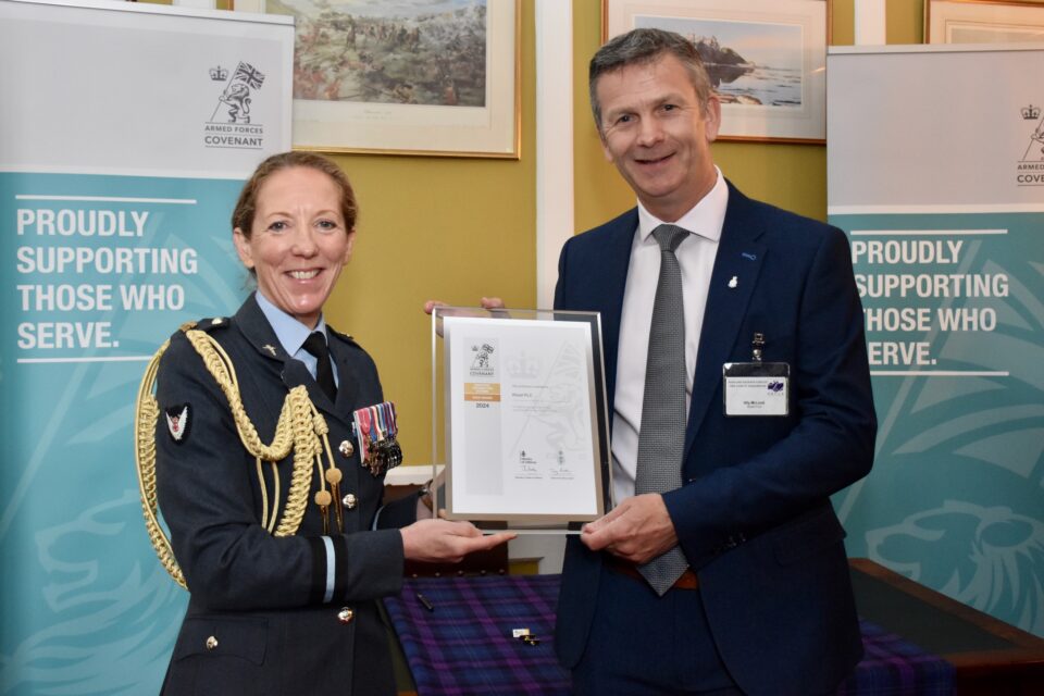 Air Commodore Sonia Phythian presents the Gold Award revalidation to Ally McLeod of Wood PLC at Edinburgh Castle.