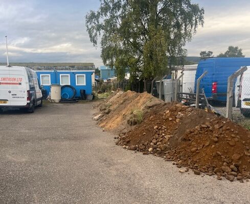 A large pile of soil in the parade area of a cadet centre.